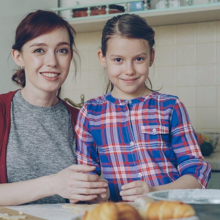 Avery Sloan, Lead Design Curator at Stem & Story Studio, reviewing corporate floral arrangements
